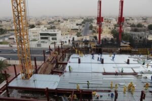 Turnkey EPC project with engineers overseeing industrial plant construction.